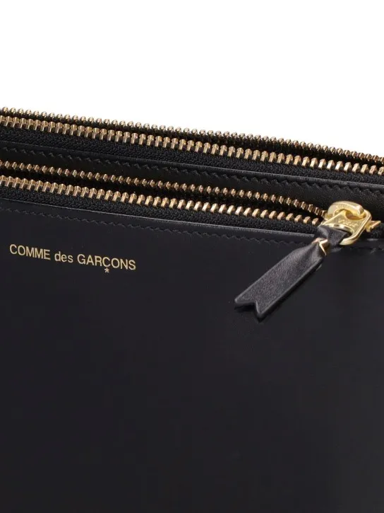 Comme des Garçons Wallet   Leather double-zip pouch 